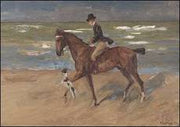 Ruiter op het strand met fox terrier